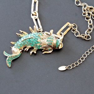 Marlyn Schiff Koi fish necklace w green crystals